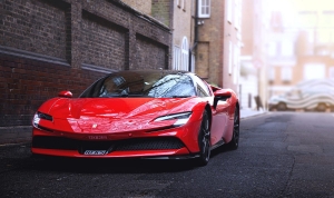 Ferrari-SF90-Stradale-red-in-an-alleyway-front-1200×712.jpg