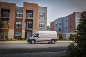 White-2022-Ram-ProMaster-driving-by-apartment-buildings-1024×683.jpg